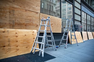 Boarded broken retail windows